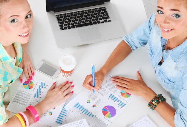 Team discussing financial graphs